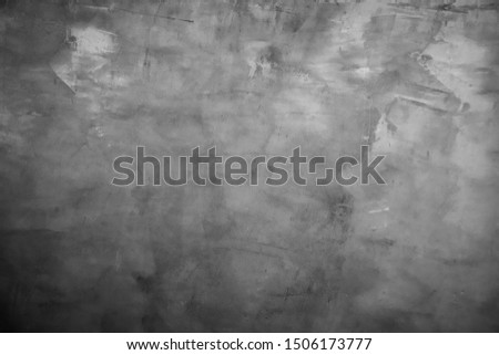 Art black concrete stone texture for background in black. Abstract color dry scratched surface wall cover colorful paper scratches shabby vintage Cement and sand grey dark detail. covering.