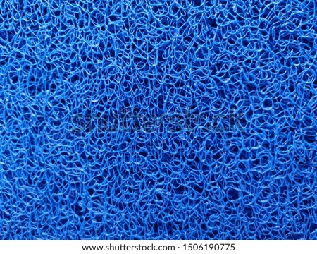 closed up the top of plastic blue fiber  doormat,background texture. 
