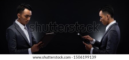 Group Pack Collage of Portrait 20s Asian Business Man under studio lighting dark background, Male in Proper Gray Suit hold digital tablet in hand and check social media, read e-mail report, iot