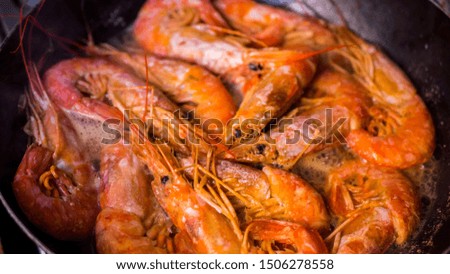 king prawns are cooked in a frying pan