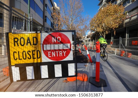 Road closed  no entry safety warning sign applying on public busy residential areas where construction worker repairing upgrading footpath at south Perth city CBD, Australia
