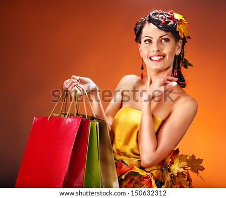 Girl with  autumn hairstyle and shopping bag.