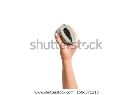 Top view of dollar banknotes in female hand on white isolated background. Business concept.