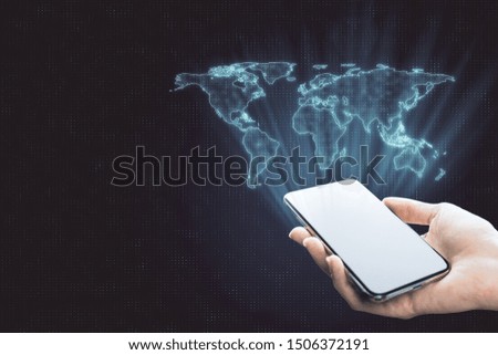 Globalization concept with digital world map from smartphone in human hand at abstract background.