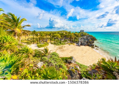 Mayan ruins of Tulum at tropical coast. God of Winds Temple at paradise beach. Mayan ruins of Tulum, Quintana Roo, Mexico.
