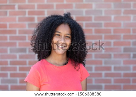 Adorable teenager girl with a beautiful afro hair 
