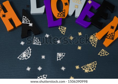 Happy Halloween wooden letters with pumpkins, spiders and other decorations