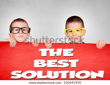 Twins holding blank red poster with best solution sign