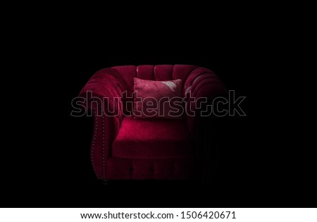 Sofa chair in low light, black background clipingpart