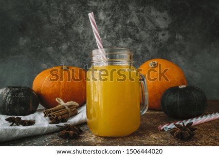 Autumn composition withÂ pumpkin drink and star anise