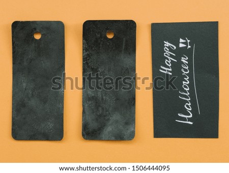 Composition with black cards and Happy Halloween inscription