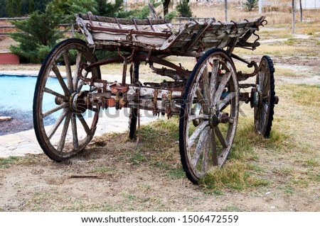Old wooden cart with four wheel.