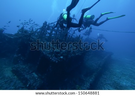Divers and Marine shipwreck  Royalty-Free Stock Photo #150648881