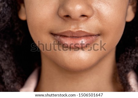 African descent girl standing isolated on pink background smiling happy lips close-up