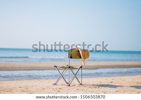 A chair on the sand on a summer holiday