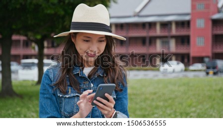Woman use of mobile phone in Yokohama Red Brick Warehouse