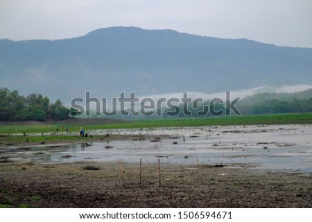 Fishing season in Thailand surrounding fog and mountains background.