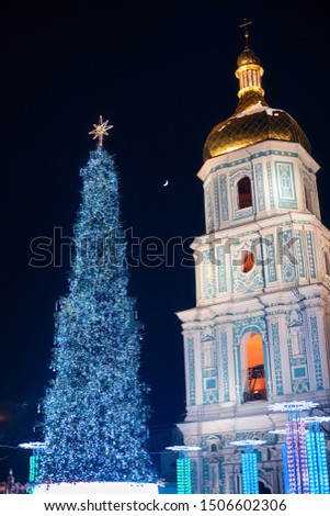 Illuminated Christmas tree at night near cathedral, Sofia Square in Kyiv