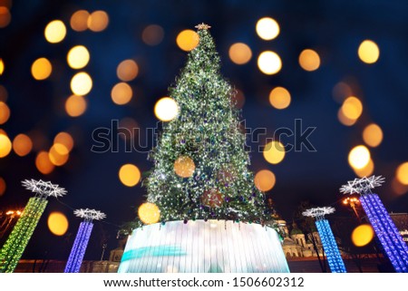 Christmas tree with defocused lights at night city, Sofia Square in Kyiv