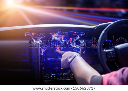 
The car user pokes the location of the place Who is going to travel Future concept of intelligent car technology, Element of this image furnished by Nasa