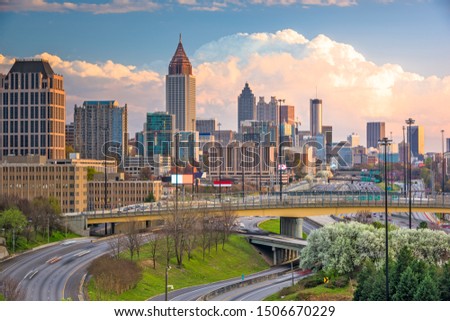 Atlanta, Georgia, USA downtown city skyline over highways at dusk.