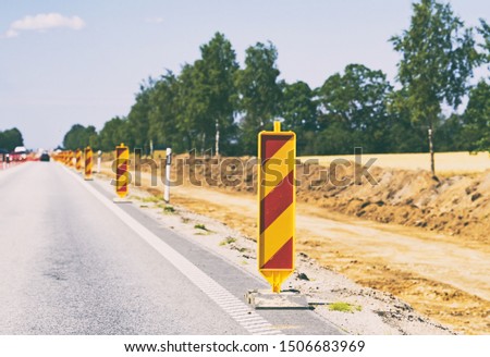 Warning signs along the road. Road reconstruction.