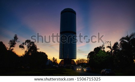 Silhouette building 'Yayasan Sabah' in Kota Kinabalu, Malaysia at sunset.