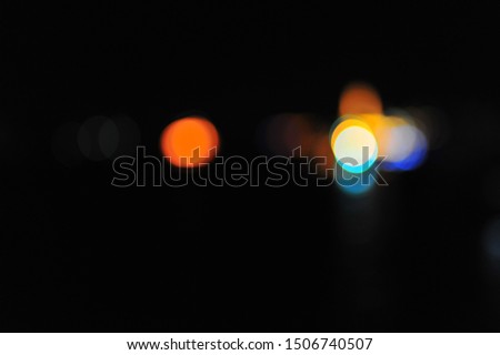 Black background with color bokeh.
