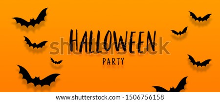 Happy halloween banner with bats flying over orange background. Halloween concept. Autumn holiday composition.
