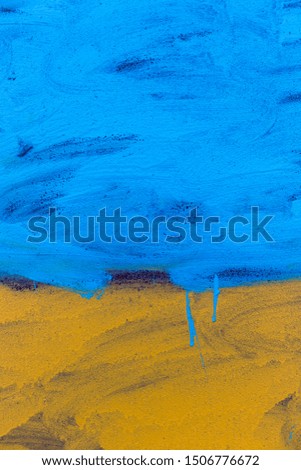 Flag of Ukraine drawn by paint on a metal surface
