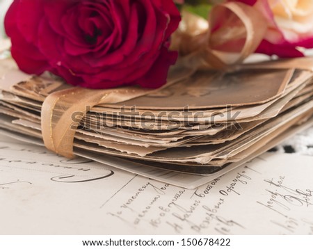 vintage background with red roses and old photos