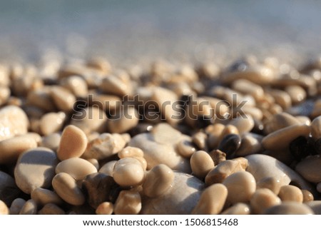 Closeup view of pebble beach on sunny day