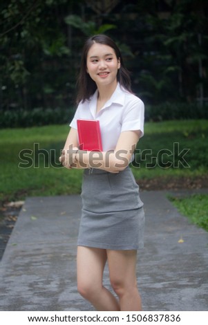 thai adult student university uniform beautiful girl relax and smile