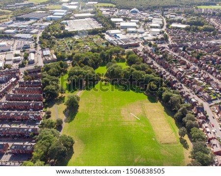 Aerial photo of the town known as Beeston in Leeds West Yorkshire UK, showing a rows of houses in a typical British housing estate taken with a drone on a bright sunny.