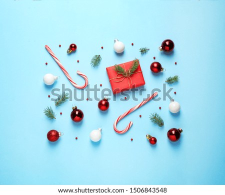 Flat lay composition with Christmas decorations on light blue background