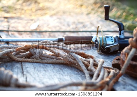 fishing tackle and accessories on wooden table