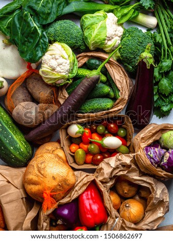 Healthy vegetarian seasonal food cooking background. Flat-lay of Autumn vegetables and herb as   parsley, spinach, mangold, top view, copy space. Clean eating, alkaline diet food, colorful vegetables
