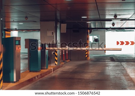 Entrance gate to underground garage parking lot, auto park interior inside, toned