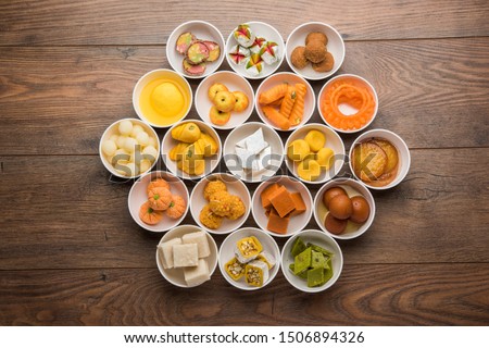 Rangoli of Assorted Indian sweets/mithai in bowl for Diwali or any other festivals, selective focus Royalty-Free Stock Photo #1506894326