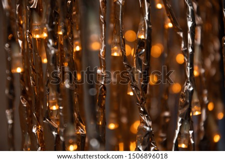 Abstract, blurry image of festive lights by night. 