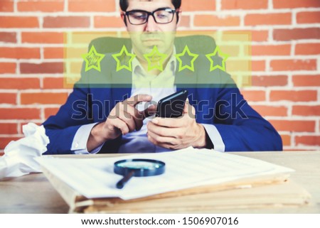 man hand phone with stars in screen