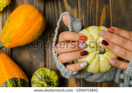 nails with pumpkins. trendy nails design. top view. place for text. flat lay pictures