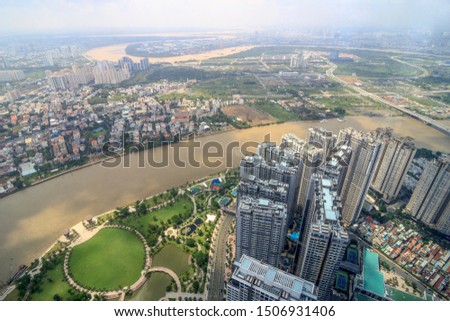 Royalty high quality free stock image aerial view of Ho Chi Minh city, Vietnam. Beauty skyscrapers along river light smooth down urban development in Ho Chi Minh City, Vietnam