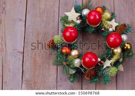 Christmas wreath over wooden background with copy space