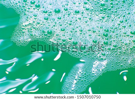 Water bubbles and water frothing close up