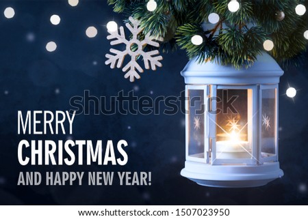 Christmas Lantern On Snow With Pine Branch. Happy New Year card.