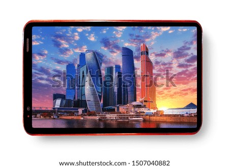Cell phone screen isolated on white background with panoramic wide angle view of skyscrapers in Moscow city district with light reflections in river water under dramatic sunset sky