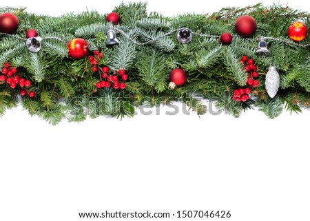 Christmas decorative background border with red bauble decorations and holly berries