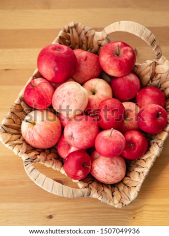 Ripe red apples in a wicker box. Top view with space for your text.