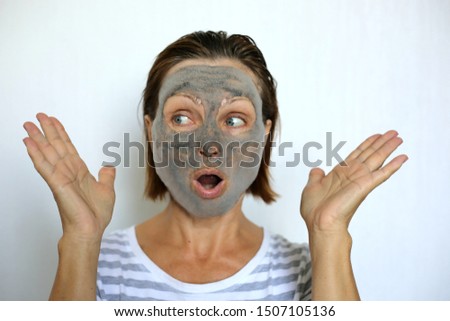 Funny woman making face bubble charcoal mask. Surprised face. Face treatment and skincare. Popular Korean cosmetic product. Bubbling oxygen mask.